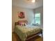 Comfortable bedroom with soft lighting and a large window offering a peaceful retreat at 305 Anise Ct, Mcdonough, GA 30252