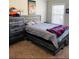 Bedroom featuring a bed with storage drawers, a dresser, and a window at 305 Anise Ct, Mcdonough, GA 30252