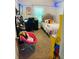 Bedroom with a bed, desk, and gaming setup, offering an excellent spot for work and play at 305 Anise Ct, Mcdonough, GA 30252