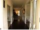Grand entryway with hardwood floors, trim, and neutral color scheme at 305 Anise Ct, Mcdonough, GA 30252