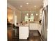 Gourmet kitchen with granite countertops, stainless steel appliances, and dark wood floors at 305 Anise Ct, Mcdonough, GA 30252