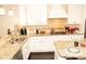 The kitchen has modern stainless steel appliances and granite countertops at 305 Anise Ct, Mcdonough, GA 30252
