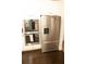 Modern stainless steel refrigerator and double ovens complement white kitchen cabinets at 305 Anise Ct, Mcdonough, GA 30252