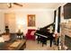 Cozy living room featuring a piano and comfortable seating arrangement perfect for relaxation at 305 Anise Ct, Mcdonough, GA 30252