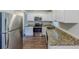 Bright kitchen showcasing stainless steel appliances, granite countertops and updated cabinets at 3197 Ward Sw Dr, Atlanta, GA 30354
