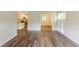 Inviting living space flowing into a kitchen featuring hardwood floors and neutral paint at 3197 Ward Sw Dr, Atlanta, GA 30354