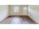 Bright living room featuring new hardwood flooring, white walls and a window with wood blinds at 3197 Ward Sw Dr, Atlanta, GA 30354