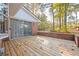 Backyard with wood deck, brick border, and large sliding glass doors at 3497 Highway 5, Douglasville, GA 30135
