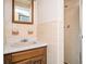 Bathroom with tiled shower stall, vanity, and mirror at 3497 Highway 5, Douglasville, GA 30135