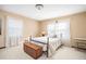 Cozy bedroom featuring neutral walls, soft carpet, natural light, and simple furnishings including a trunk at 3497 Highway 5, Douglasville, GA 30135