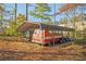 Carport with vehicles in wooded area at 3497 Highway 5, Douglasville, GA 30135