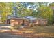 Charming one-story brick home with driveway and wooded lot at 3497 Highway 5, Douglasville, GA 30135