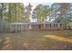 Traditional brick home with a well-manicured lawn and mature trees providing ample shade at 3497 Highway 5, Douglasville, GA 30135
