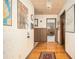 Hallway featuring hardwood floors, vintage decor, and access to multiple rooms at 3497 Highway 5, Douglasville, GA 30135