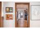 View into kitchen from hallway features wood cabinets and hardwood flooring at 3497 Highway 5, Douglasville, GA 30135