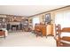Spacious living room featuring a brick fireplace, built-in bookshelves, and neutral carpeting at 3497 Highway 5, Douglasville, GA 30135