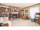 Comfortable living room with brick fireplace and large bookshelves, perfect for relaxing at 3497 Highway 5, Douglasville, GA 30135