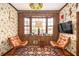 Unique sitting room featuring a bay window, wood paneling, and retro design elements at 3497 Highway 5, Douglasville, GA 30135