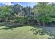 Well-maintained backyard with lush green grass and mature trees at 645 Earlham Dr, Suwanee, GA 30024
