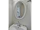 Powder room featuring a vanity with chrome faucet and mirror at 645 Earlham Dr, Suwanee, GA 30024