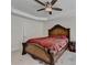This bedroom features a tray ceiling, ceiling fan, and classic wooden bed frame at 645 Earlham Dr, Suwanee, GA 30024