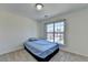 Bedroom with a single bed, large window, and neutral carpet at 645 Earlham Dr, Suwanee, GA 30024