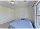 Cozy bedroom featuring a window providing natural light and a comfortable bed, perfect for relaxation at 645 Earlham Dr, Suwanee, GA 30024