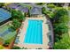 Community pool features a large swimming area surrounded by lounge chairs at 645 Earlham Dr, Suwanee, GA 30024