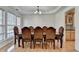 Formal dining room featuring a large dining table, chandelier, and hardwood floors at 645 Earlham Dr, Suwanee, GA 30024