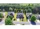 An attractive two-story home with a two-car garage and manicured front lawn nestled among mature trees at 645 Earlham Dr, Suwanee, GA 30024