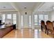 Bright foyer with hardwood floors and elegant columns leading to the adjacent rooms at 645 Earlham Dr, Suwanee, GA 30024
