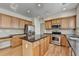 Well-appointed kitchen with central island, stainless steel appliances, and ample cabinet space at 645 Earlham Dr, Suwanee, GA 30024