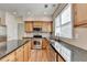 Bright kitchen with stainless steel appliances, granite counters, and plenty of cabinet space at 645 Earlham Dr, Suwanee, GA 30024