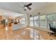 Living room with hardwood floors and windows overlooking the yard at 645 Earlham Dr, Suwanee, GA 30024