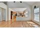Living room showing opening to the kitchen and natural light at 645 Earlham Dr, Suwanee, GA 30024