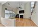 Bright living room featuring a fireplace, large windows, and hardwood floors at 645 Earlham Dr, Suwanee, GA 30024