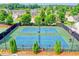 Community tennis courts with well-maintained green and blue surface at 645 Earlham Dr, Suwanee, GA 30024