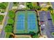 Aerial view of tennis courts with parking and lush landscaping at 645 Earlham Dr, Suwanee, GA 30024