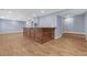 Finished basement with a bar, recessed lighting, and wood-look vinyl flooring at 2520 Wood Fern Ln, Cumming, GA 30041
