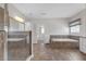Spacious bathroom with a glass shower, a soaking tub, and white vanities at 2520 Wood Fern Ln, Cumming, GA 30041