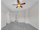 Large bedroom with light-colored walls, gray carpet and multiple entry doors at 2520 Wood Fern Ln, Cumming, GA 30041
