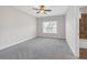 Empty bedroom with gray carpet, light walls, and an ensuite bathroom at 2520 Wood Fern Ln, Cumming, GA 30041