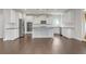 Bright kitchen featuring white cabinetry, stainless steel appliances, granite countertops, and a spacious island at 2520 Wood Fern Ln, Cumming, GA 30041