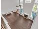 Bright, open living area with dark hardwood floors, a cozy fireplace, and large windows at 2520 Wood Fern Ln, Cumming, GA 30041