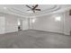 Spacious main bedroom with coffered ceilings, neutral walls, and multiple access doors at 2520 Wood Fern Ln, Cumming, GA 30041