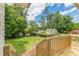 Exterior view of the backyard including a wooden deck and surrounding greenery at 3275 Clifton Church Se Rd, Atlanta, GA 30316