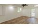 Spacious basement area featuring new flooring, a window, and access to the exterior through a door at 3275 Clifton Church Se Rd, Atlanta, GA 30316