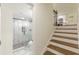 Bathroom view showcases tile floors and glass enclosed shower, next to the staircase at 3275 Clifton Church Se Rd, Atlanta, GA 30316