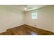 Bright bedroom featuring hardwood floors, a ceiling fan, and a window providing natural light at 3275 Clifton Church Se Rd, Atlanta, GA 30316