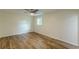 Bedroom featuring laminate wood flooring, a ceiling fan, and a window offering natural light at 3275 Clifton Church Se Rd, Atlanta, GA 30316